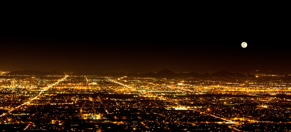 The sprawling city of Phoenix at night, increasing housing demand